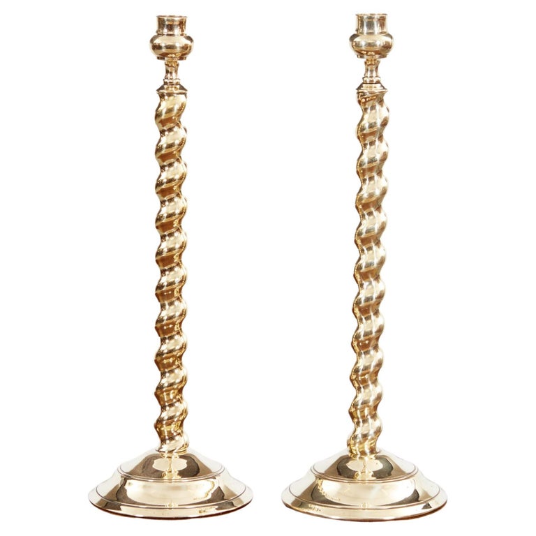 A pair of tall brass barley twist candlesticks, other candlesticks, copper  and brass etc